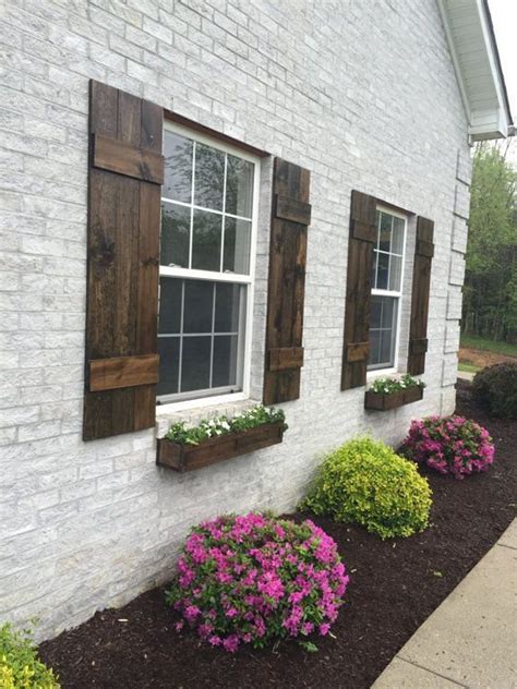 white house wood stained shutters.